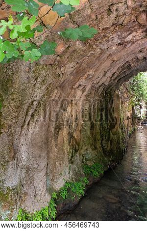 Tunnel Pierced In The Mountain By A Mountain River In A Hermon Stream Nature Reserve In Northern Isr