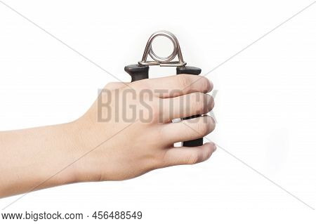 Teenager's Hand With Hand Expander, Hand Gripper On White Background. Hand Grip Strengthening Tool. 