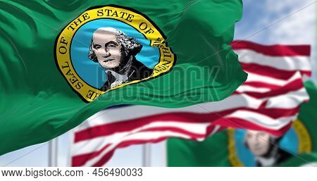 The Washington State Flag Waving Along With The National Flag Of The United States Of America. Washi