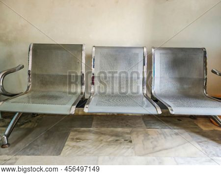 Stock Photo Of Stainless Steel Chairs Installed Near Wall. These Type Of Chairs Used In Hospital, Ma