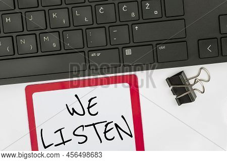 Text Caption Presenting We Listen. Internet Concept Group Of Showing That Is Willing To Hear Anythin