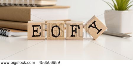 Eofy, End Of Financial Year Text. Wood Cubes And White Background.