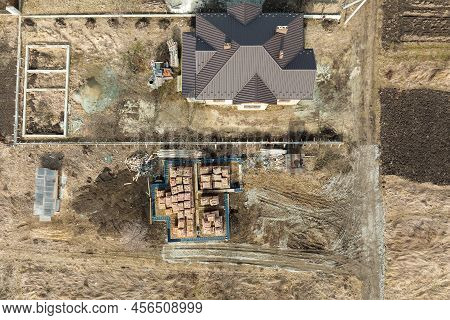 Aerial View Of Building Works Of New House Concrete Foundation On Construction Site