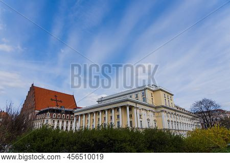 Buildings Near Church St Dorothea With Blue Sky At Background In Wroclaw