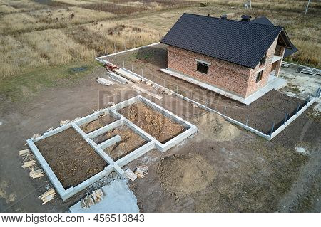Top Down Aerial View Of Building Works Of New House Concrete Foundation On Construction Site
