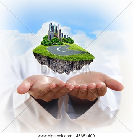 Immagine di un paesaggio urbano moderno nella mano di un uomo d'affari