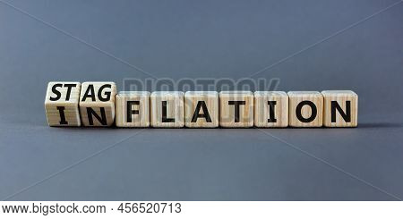 Stagflation Or Inflation Symbol. Turned Wooden Cubes And Changed The Concept Word Inflation To Stagf