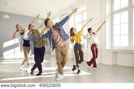Happy Energetic Young Hip-hop Dancers Dance Together In Bright Spacious Dance Studio.