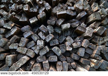Larger Piles Of Stacked Used Wooden Railway Sleepers. Wooden Sleepers Are Better Than Other Railway 