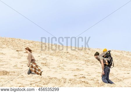Pilat, France - February 22, 2022: Family Of Tourists, Parents With Children, Climbing The Pilat Dun