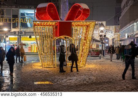 Belgrade, Serbia - January 10, 2022: Girls Taking A Selfie In Front Of Giant Gift Wrap Used As The M