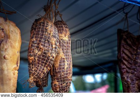 Serbian Ham, Called Prsut, Italian Style, Similar To Prosciutto Crudo, Wrapped In A Ham Net Hanging 