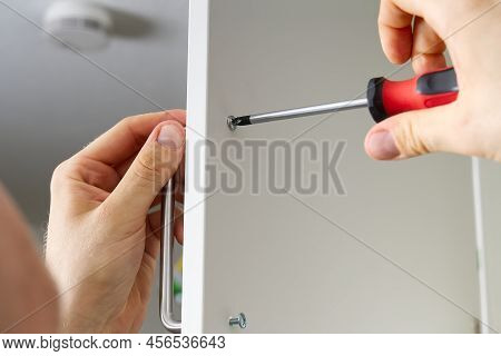 Professional Furniture Assembly Worker Assembles Shelf. Furniture Assembly Process. Diy Assembling