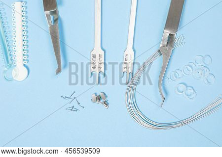 A Set Of Special Tools For An Orthodontist To Install Braces For A Patient. Orthodontic Arcs, Ligatu