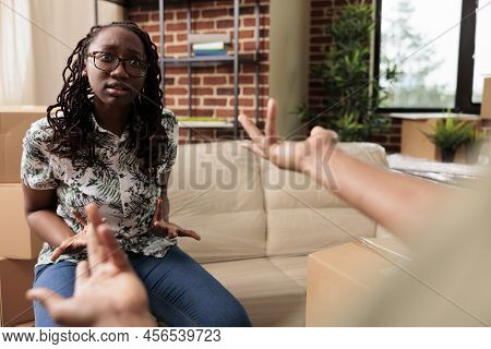 Irritated Wife Having Argument With Husband After Moving In New Household Flat, Feeling Angry About 