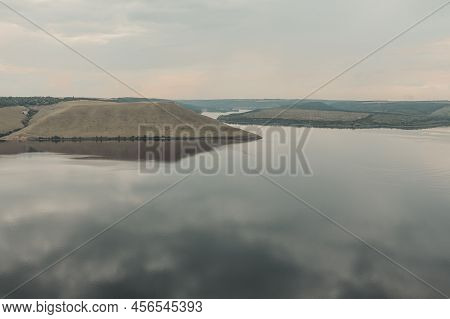 Smooth Calm Water Panoramic Landscape. The Banks Of A Large River. Bakota, Dniester River, Ukraine.