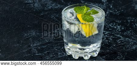 Banner With Serving Mojito In Glass. Drink With Lemon, Mint, Soda And Ice On A Black And White Backg