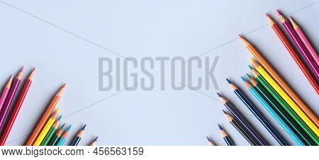 Banner Of Color Pencils On Light Gray Blue Background. Top View With Space For Text. Back To School 