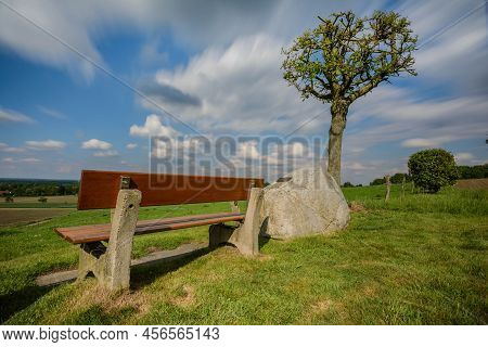 A Bench And A View Of A Valley In Germany