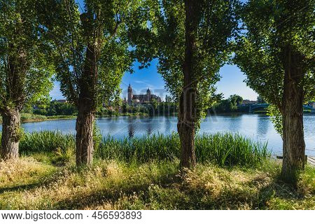 Rio Tormes And Cathedral Of The City Of Salamanca In Spain.