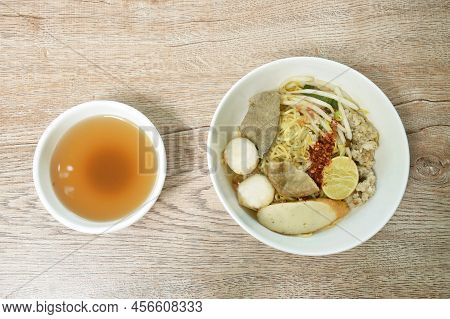 Boiled Dry Chenese Yellow Egg Noodles With Entrails And Meatball On Bowl