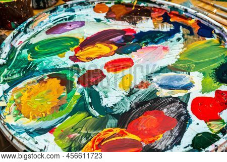 Bright Spots Of Paint In An Art Workshop