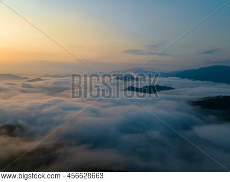 Sunrise Over Sea Of Clouds And Mountain Peaks