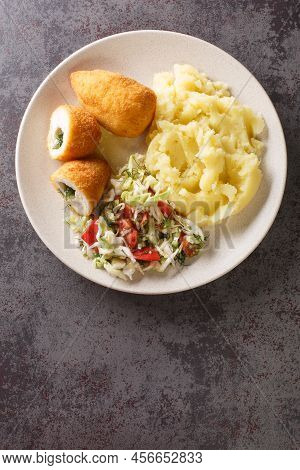 Ukrainian Food Kyiv Cutlet Of Chicken Fillet With Butter And Herbs Served With Mashed Potatoes And V