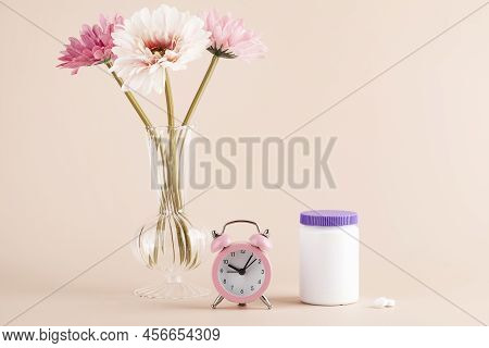 Women Health, Middle Age And Menopause Concept. Health Care Style. Copy Space. White Plastic Bottle 