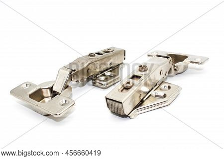 A Picture Of Stainless Steel Hydraulic Hinges With Selective Focus