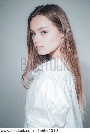 Headshot Portrait Of Beauty Girl With Beauty Face Looking At Camera. Close Up Portrait Of Young Chee