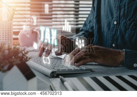 Tax Concept For Business, Businessman Using Computer To Complete Individual Income Tax Return Form O