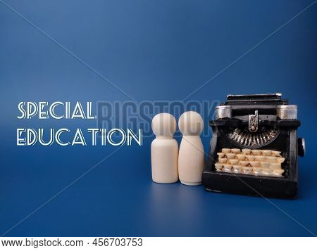 Wooden Figures And Vintage Typewritter With The Word Special Education.