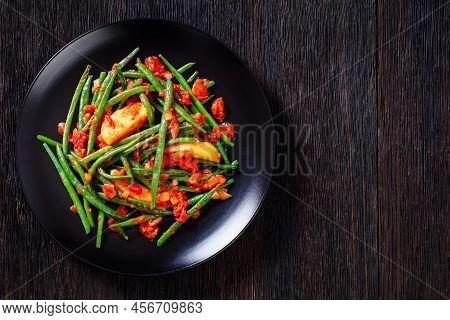 Fasolakia Lathera, Green Beans, Onion And Potatoes Stewed In Tomato, Herbs And Olive Oil Served On B