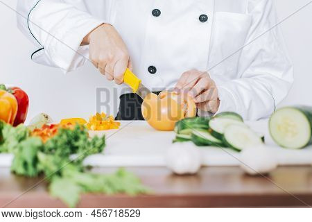 Chef Woman Hands Cutting Tomatoes And Vegetables, Close Up Of Chef Woman Hands Cutting Tomatoes And