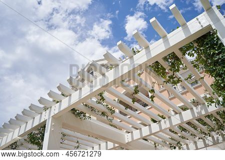 White Wooden Pergola Roof For Shade Againt Sky