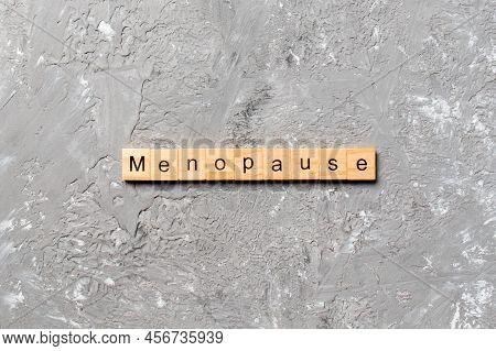 Menopause Word Written On Wood Block. Menopause Text On Table, Concept.