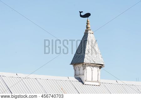 Wind Vane Over An Old Building At Ushuaia, Tierra Del Fuego, Argentina.