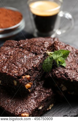 Delicious Chocolate Brownies With Nuts And Fresh Mint On Slate, Closeup