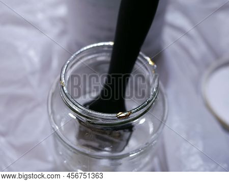 Paint Brush In A Jar Of Turpentine
