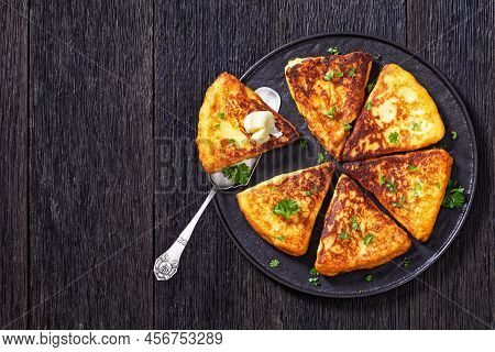 Potato Farls, Irish Potato Cakes, Potato Bread Topped With Butter On Black Plate On Dark Wooden Tabl