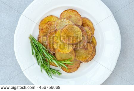 Portion Of Fried Sliced Potatoes On The Plate