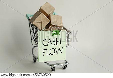A Sticky Note Attached To A Decorative Grocery Cart Along With Small Packaged Letterboxes. Lettering