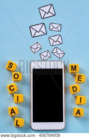 Vertical Shot Social Media And Messanging Concept. Smartphone With Black Screen On Blue Background.