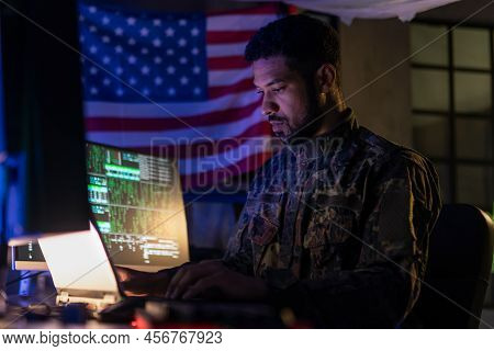 American Hacker In Military Unifrorm On Dark Web, Cyberwar Concept.