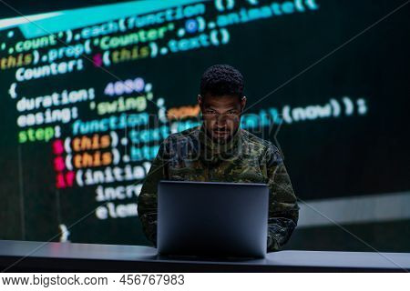 Hacker In Military Unifrorm On Dark Web, Cyberwar Concept.