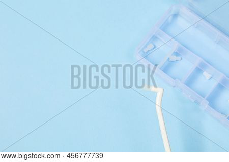 Orthodontic Toothbrush With One Bundle For Braces On A Blue Background Special Tool For Oral Care