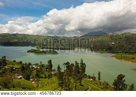 Top View Of Lake In The Mountains Surrounded By Hills With Tea Plantations. Maskeliya, Castlereigh, 