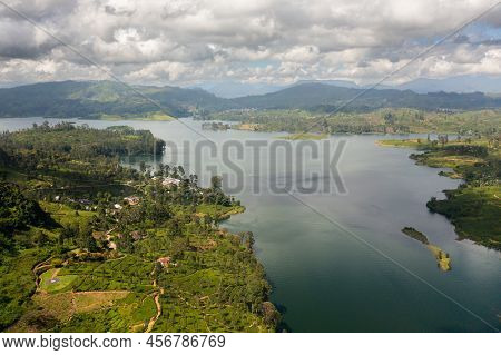 Aerial Drone Of Lake In The Mountains Among The Tea Plantations. Maskeliya, Maussakelle Reservior, S