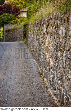 Menthon Saint Bernard, France - September 10 2020 : The Historic Stone Protection Wall Of A Castle O